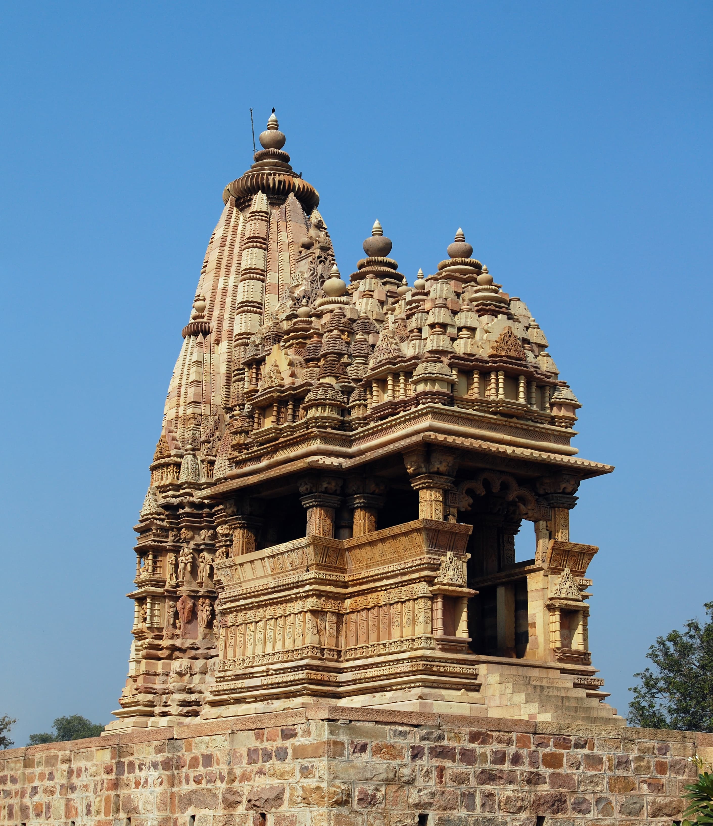 Stone shikhara and entrance of Javari Temple at Khajuraho, India.